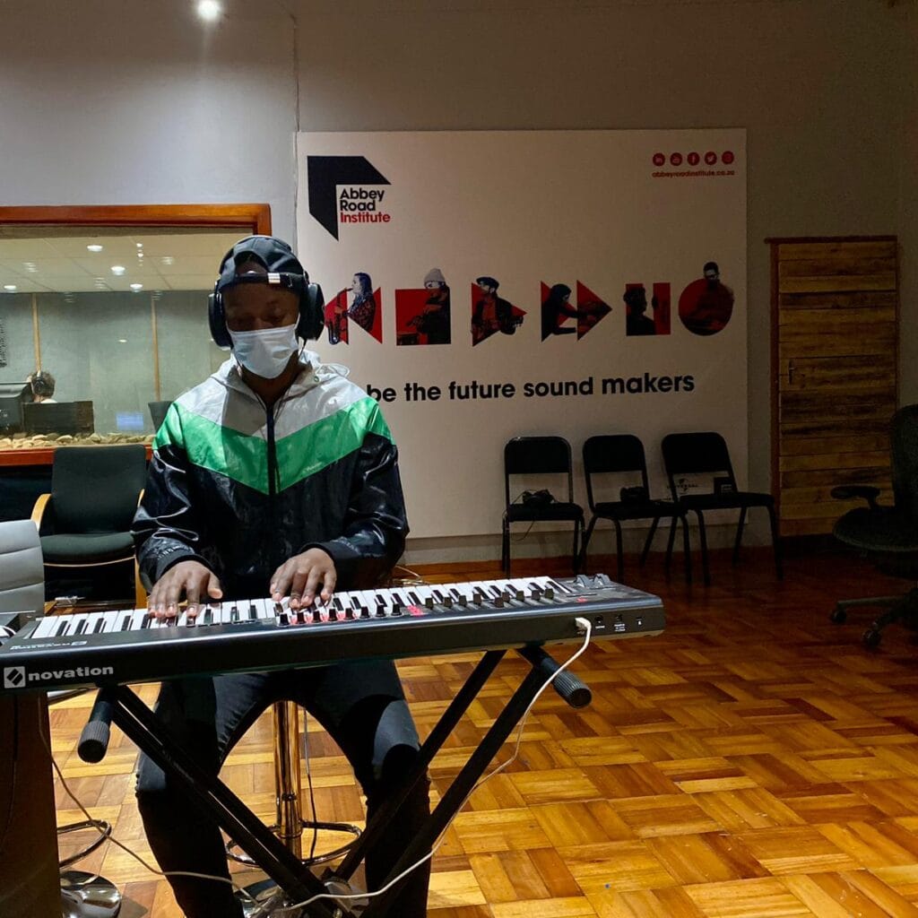 Abbey Road Institute Sound engineering Students playing keyboard in studio in live room