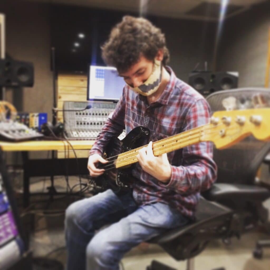 Abbey Road Institute Sound engineering Student playing guitar in studio in live room